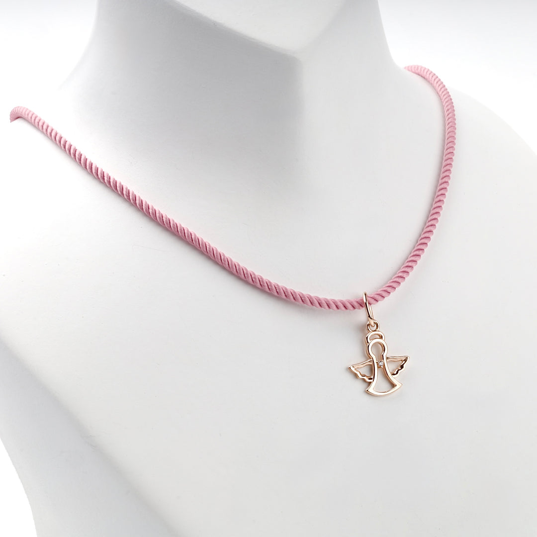14K rose gold openwork angel pendant, angled view