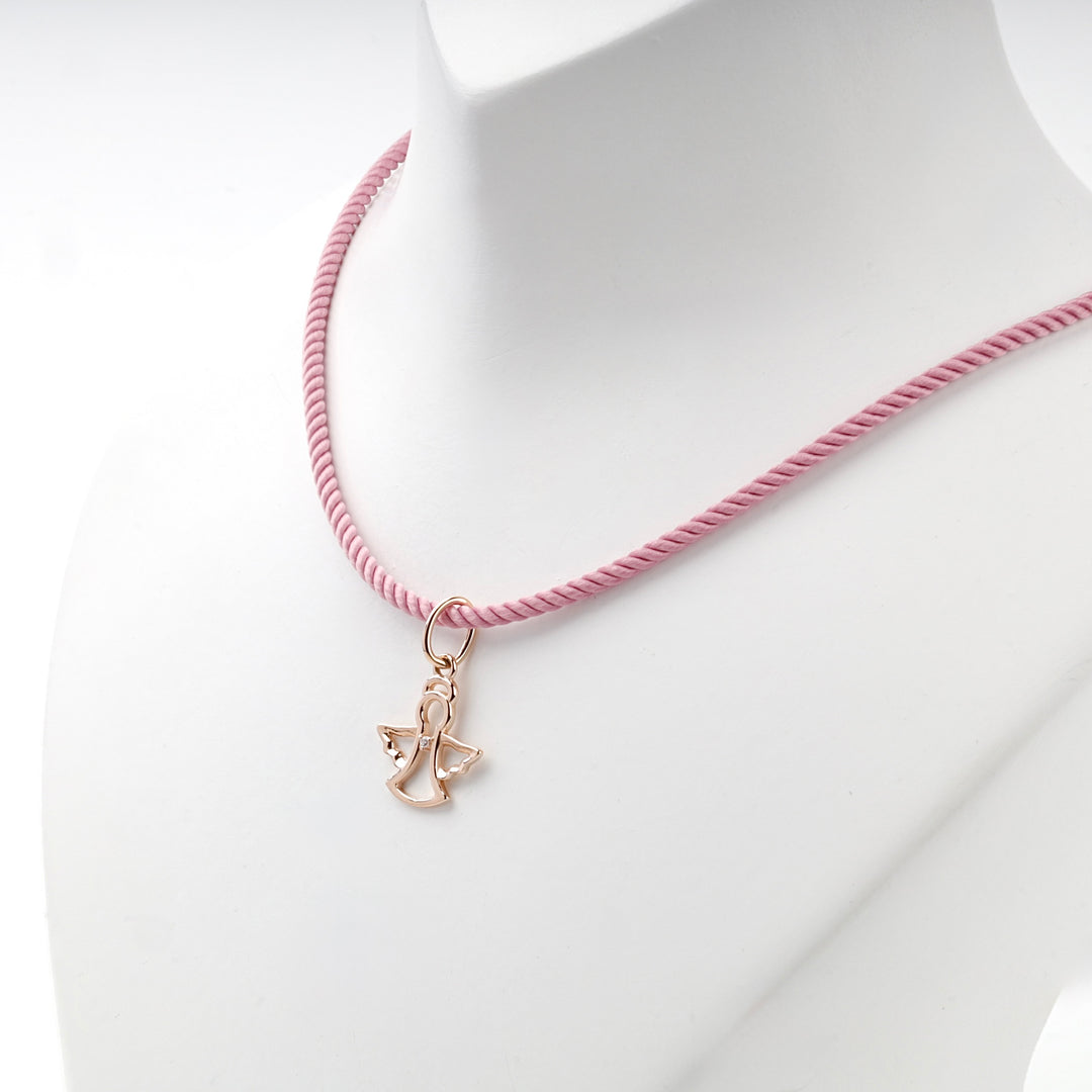 Rose gold angel pendant on a pink cord, worn view
