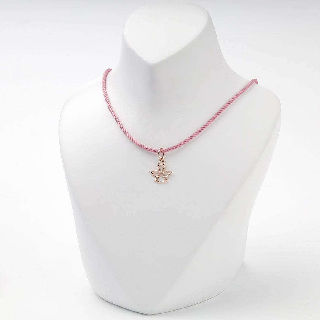 Rose gold openwork angel pendant with cubic zirconia, overhead view