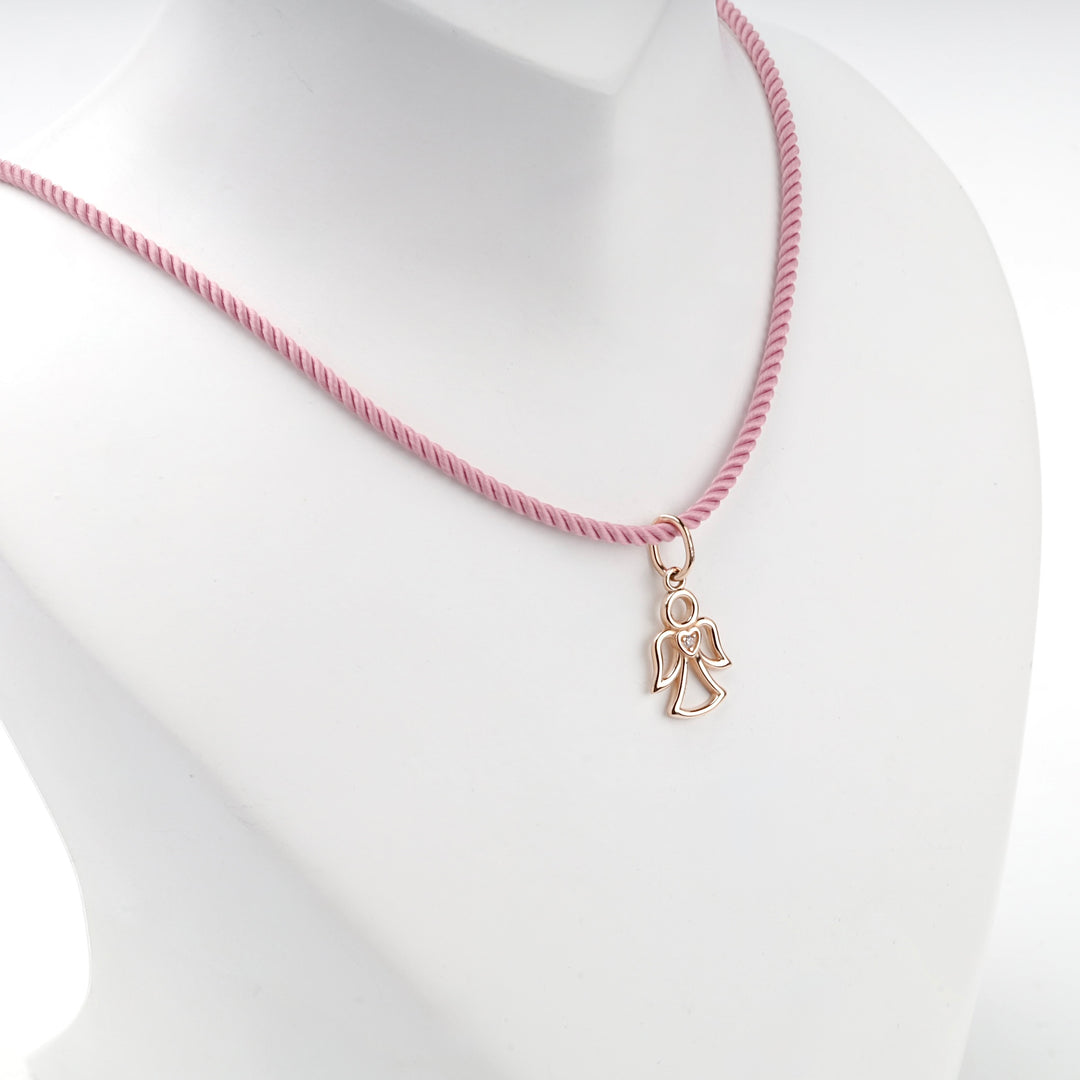 14K rose gold openwork angel pendant, angled view