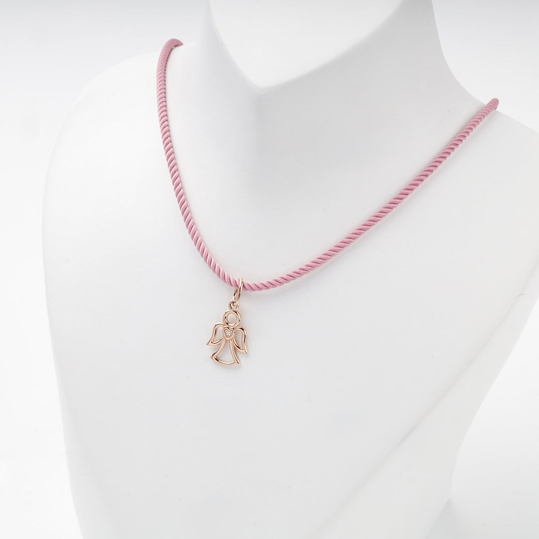 Rose gold angel pendant on a pink cord, worn view