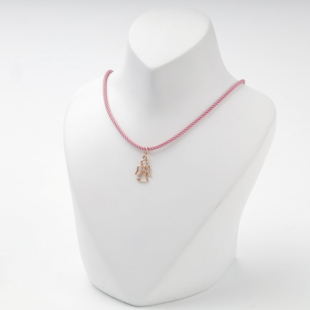 Rose gold openwork angel pendant with heart and cubic zirconia, overhead view