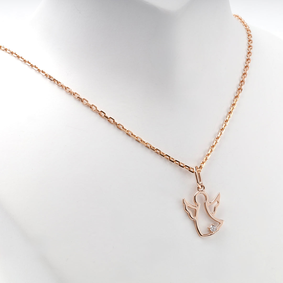 14K rose gold openwork angel pendant, angled view