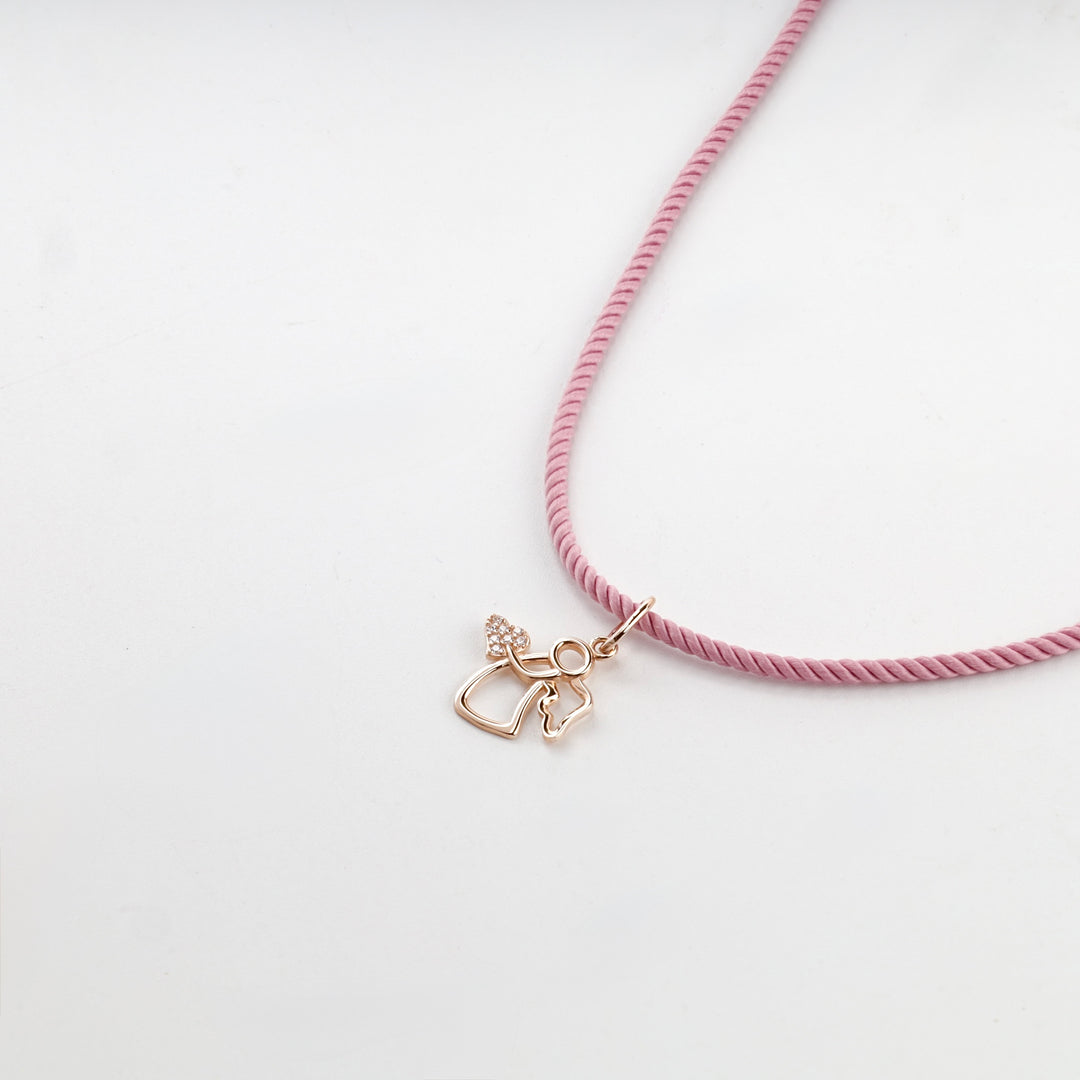 Rose gold guardian angel pendant with a heart, studio view