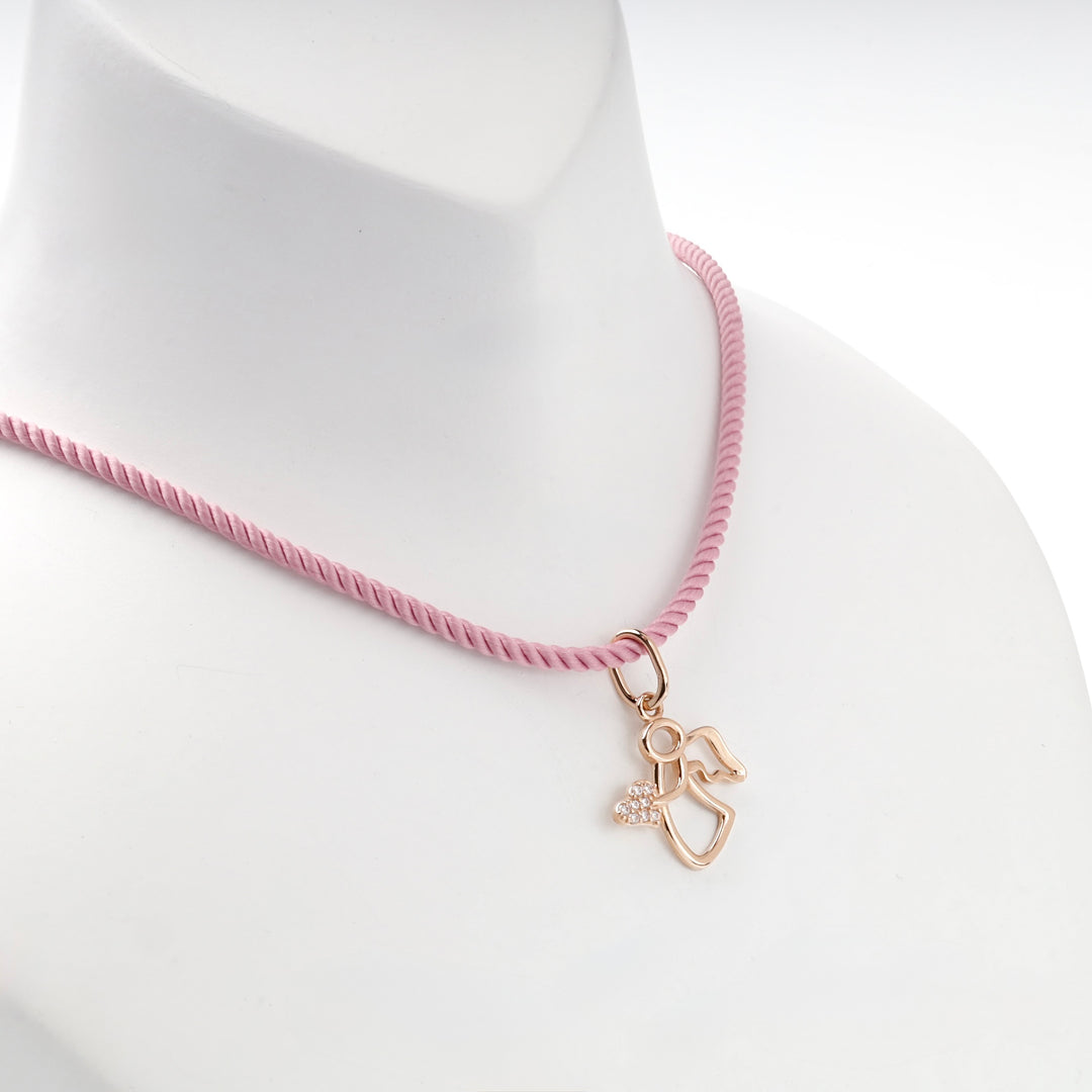 14K rose gold openwork angel pendant, angled view
