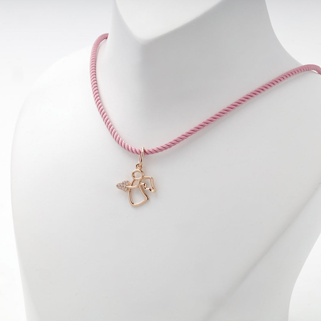 Rose gold angel pendant on a pink cord, worn view