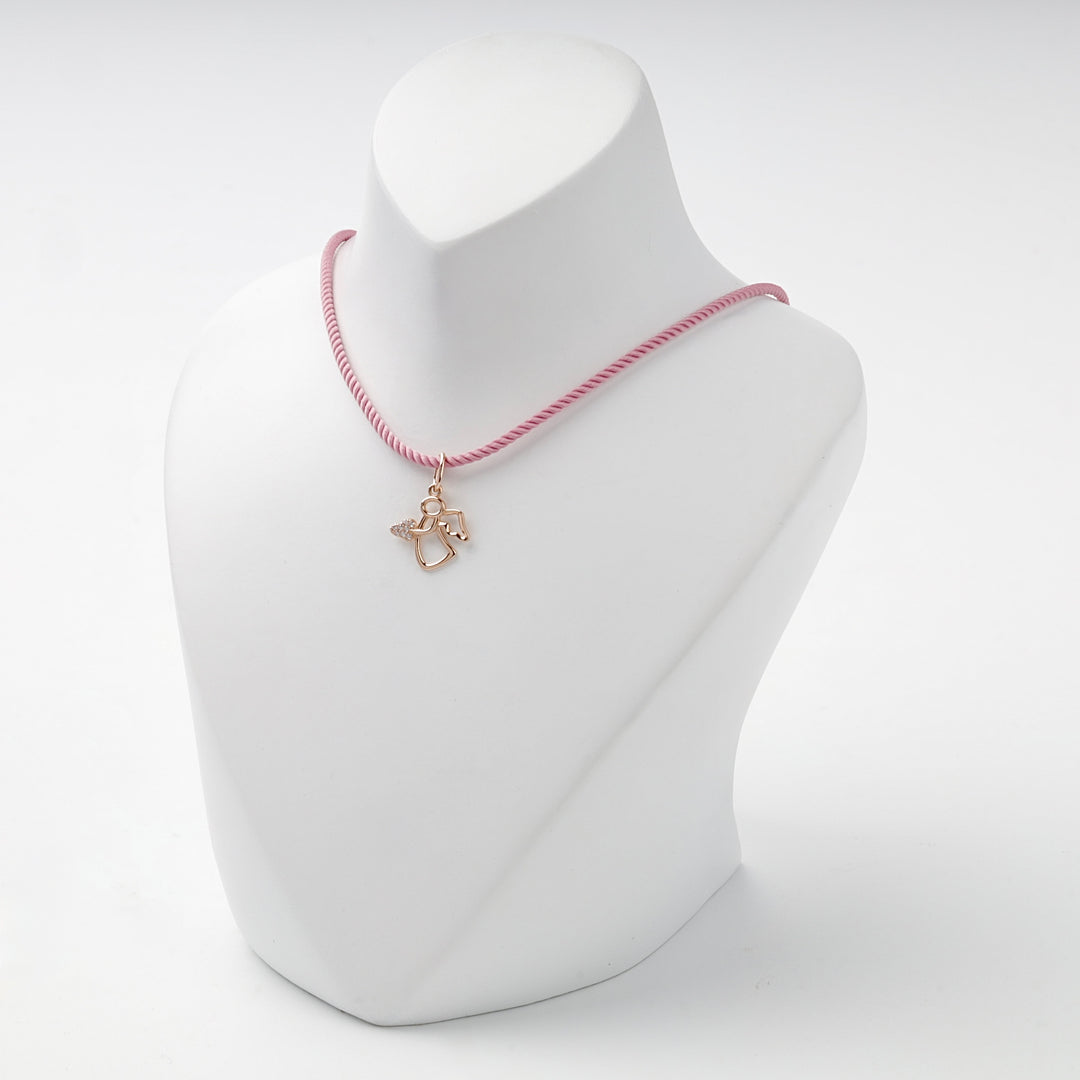 Rose gold openwork angel pendant with a pavé cubic zirconia heart, overhead view