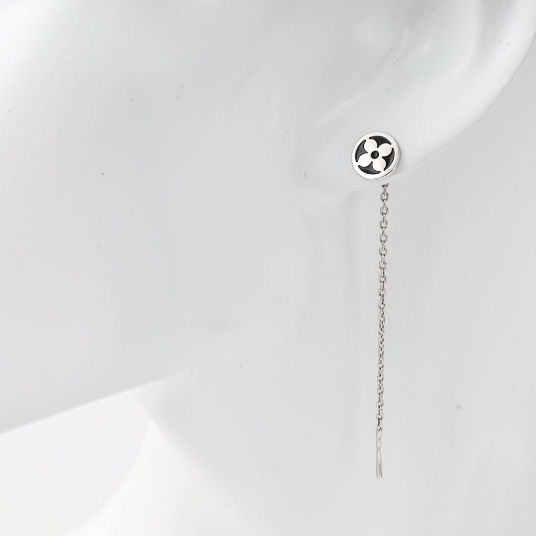 Sterling silver long chain drop earring with round floral stud shown on ear, minimalist Ukrainian Jewelry for women.