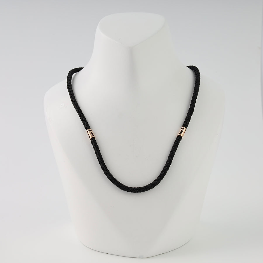 Black braided cord necklace with two rose gold accents on bust display, Ukrainian Jewelry, minimalist gold necklace gift for men.