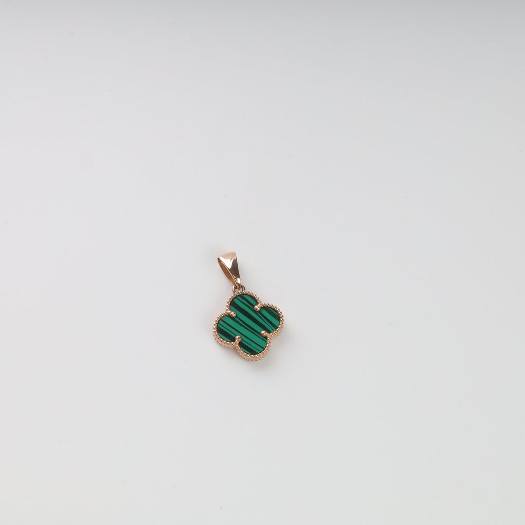 Gold and green clover-shaped pendant with malachite stone on a plain white background.