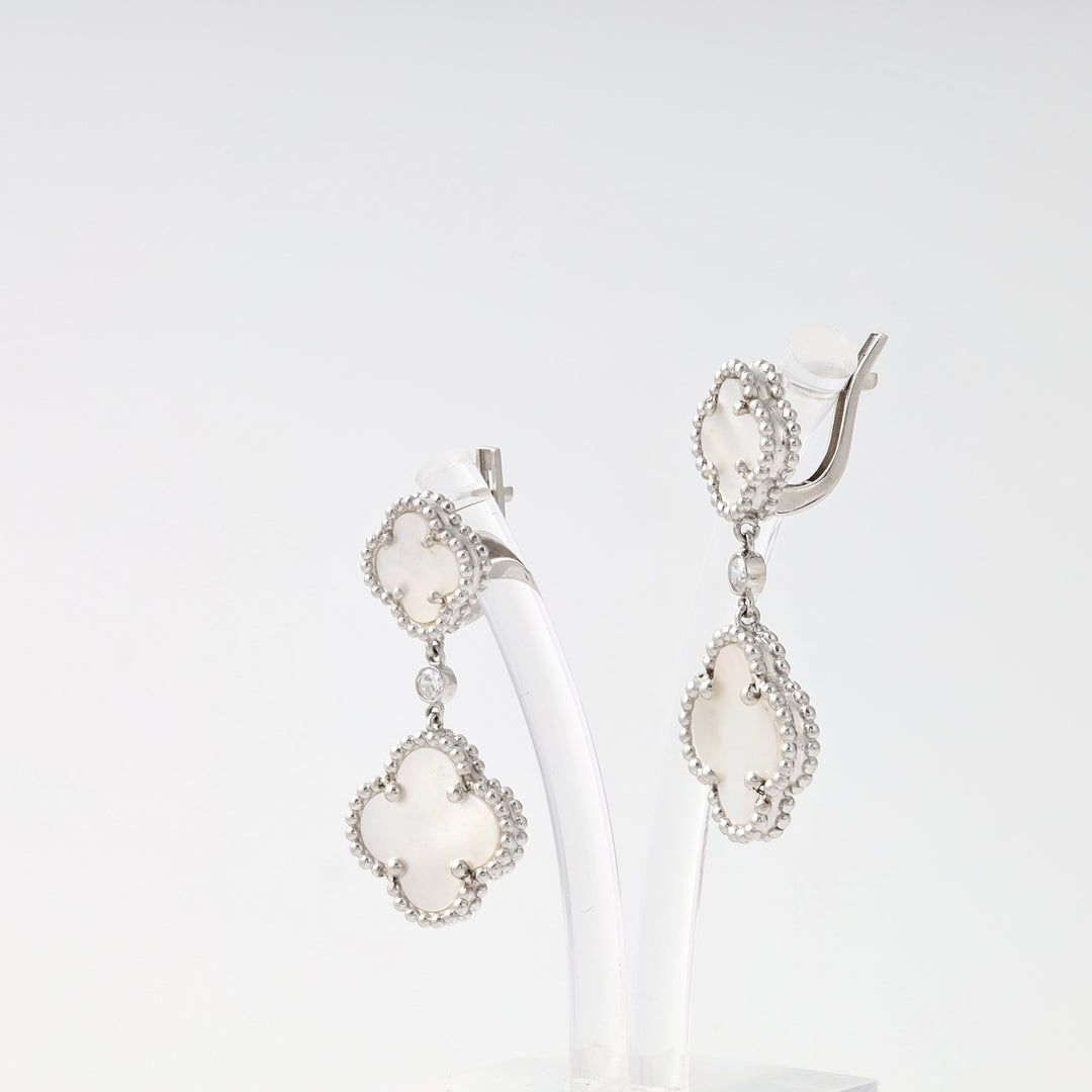 Sterling silver clover drop earrings with mother of pearl inlay on display, Ukrainian Jewelry, dangle earrings, silver statement earrings.