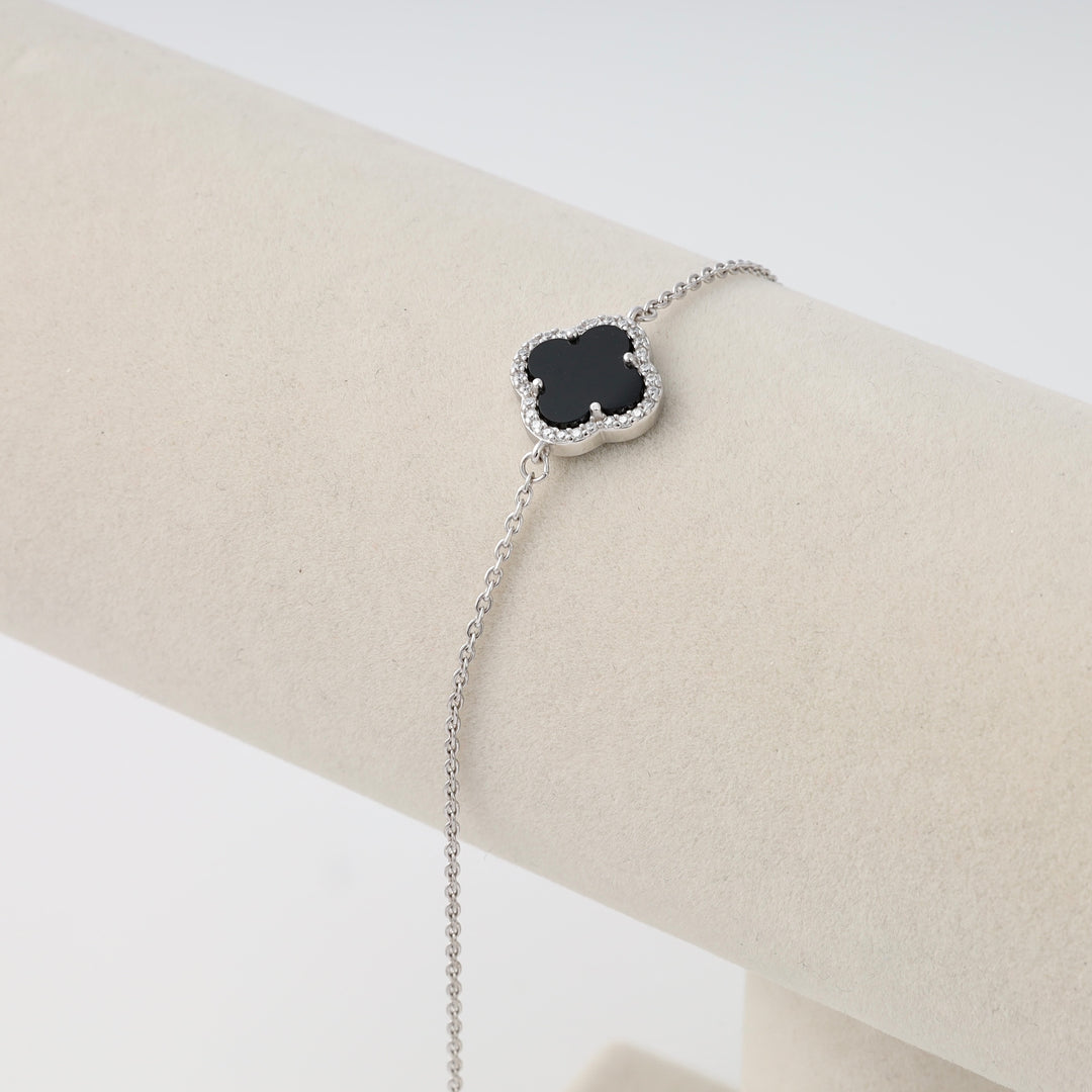 Sterling silver bracelet with black clover charm and crystal halo on display stand, Ukrainian Jewelry, dainty silver chain bracelet.