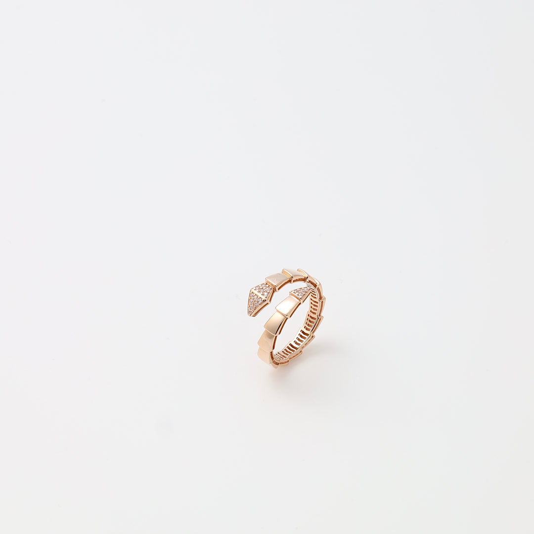 Rose gold ring with geometric arrow motif and tiny crystals on white background, 14k gold Ukrainian Jewelry, stackable ring gift.