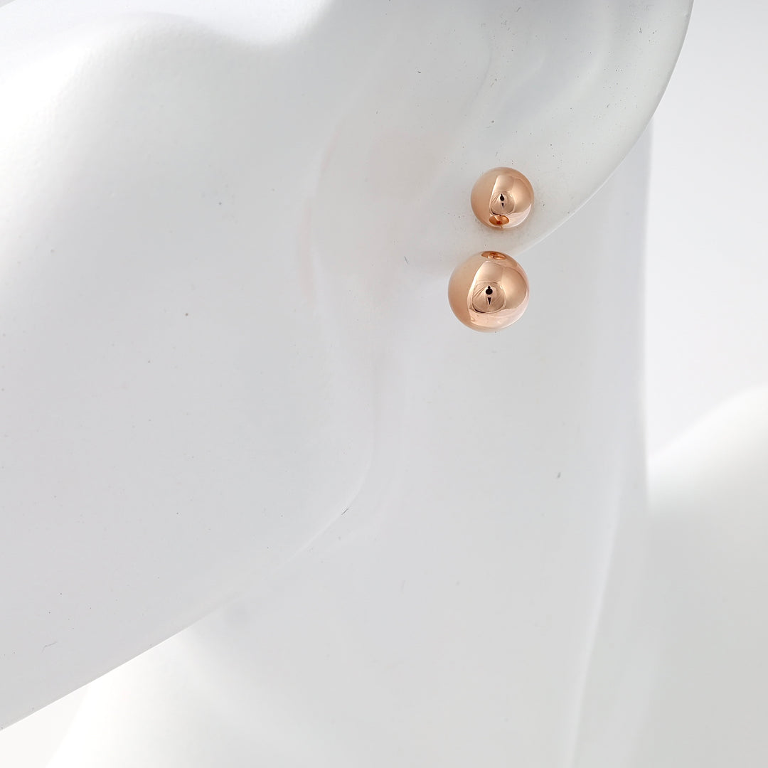 Rose gold double ball stud earrings in 14k gold, minimalist drop studs, Ukrainian Jewelry for everyday gold stud earring style.