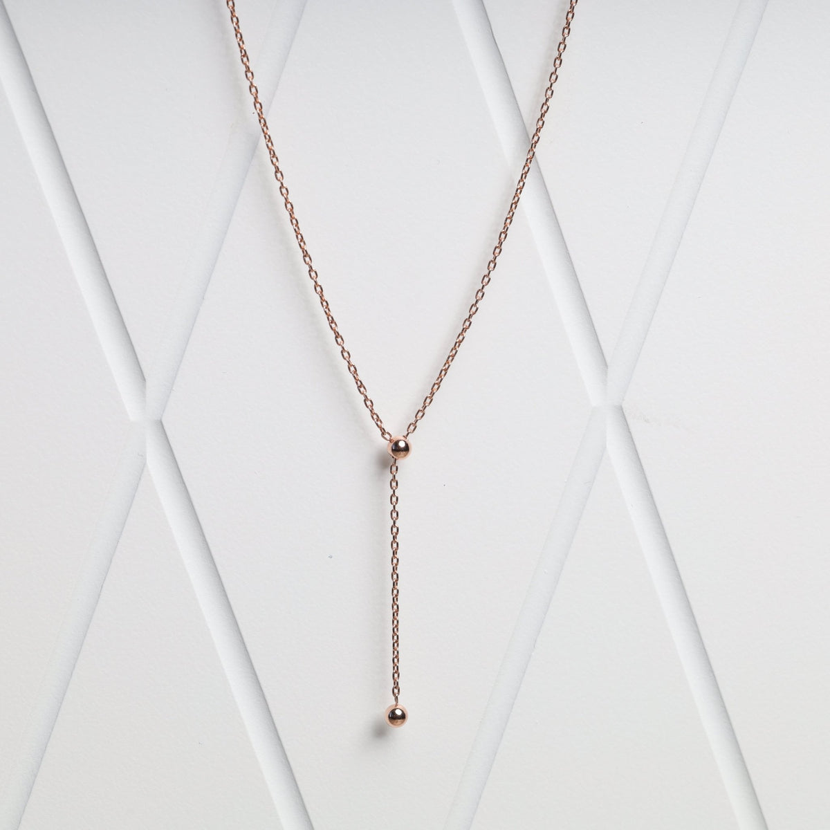 Ball tie necklace in 14K rose gold 585 front view Ukrainian Jewelry