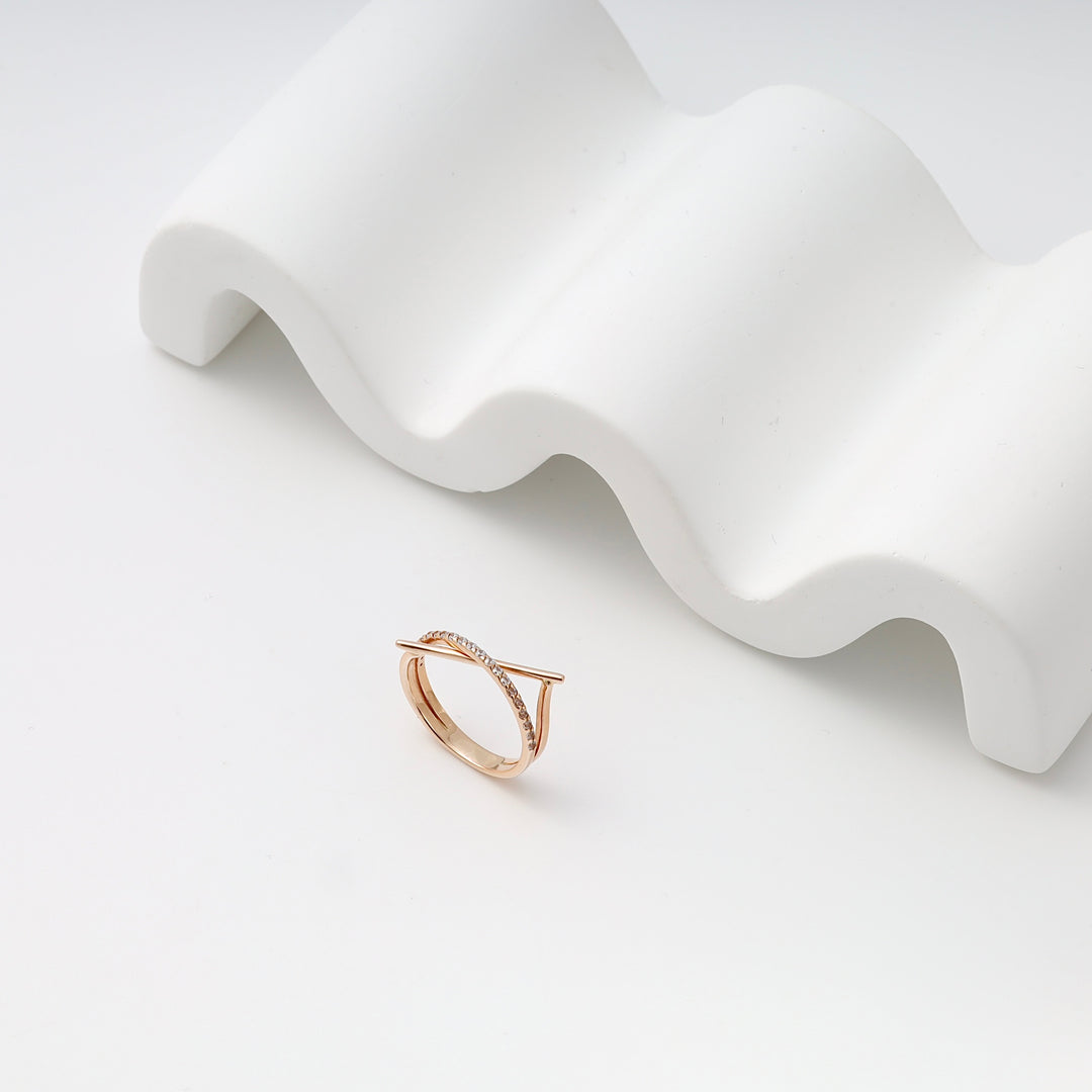 Rose gold ring with delicate cubic zirconia bar detail on white display, Ukrainian Jewelry, minimalist gold ring, dainty stacking ring.