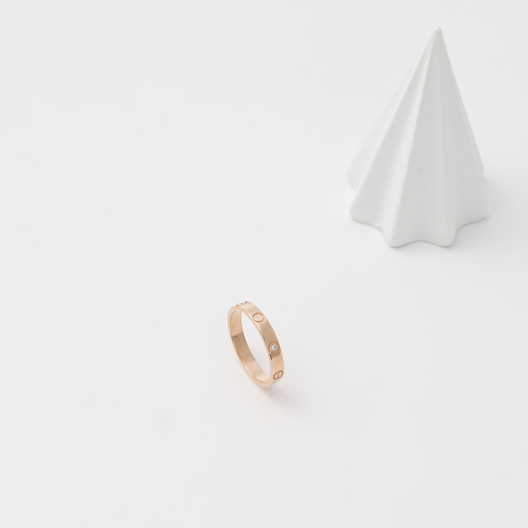 Rose gold ring with small round studs on white background, minimalist 14k gold band Ukrainian Jewelry, simple gold ring for women.
