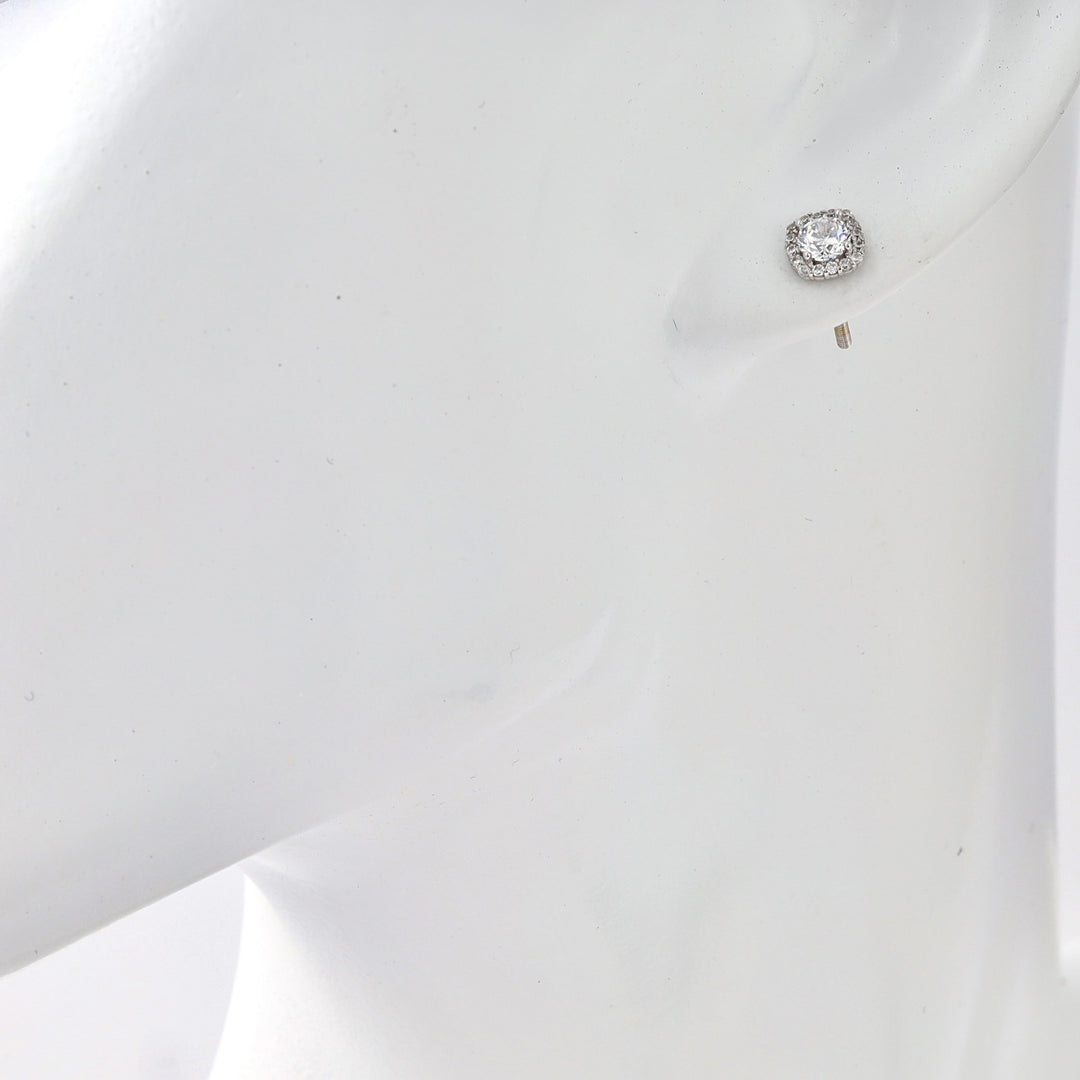 Sterling silver halo stud earring with round crystal on ear display, Ukrainian Jewelry, simple silver stud earrings for women.