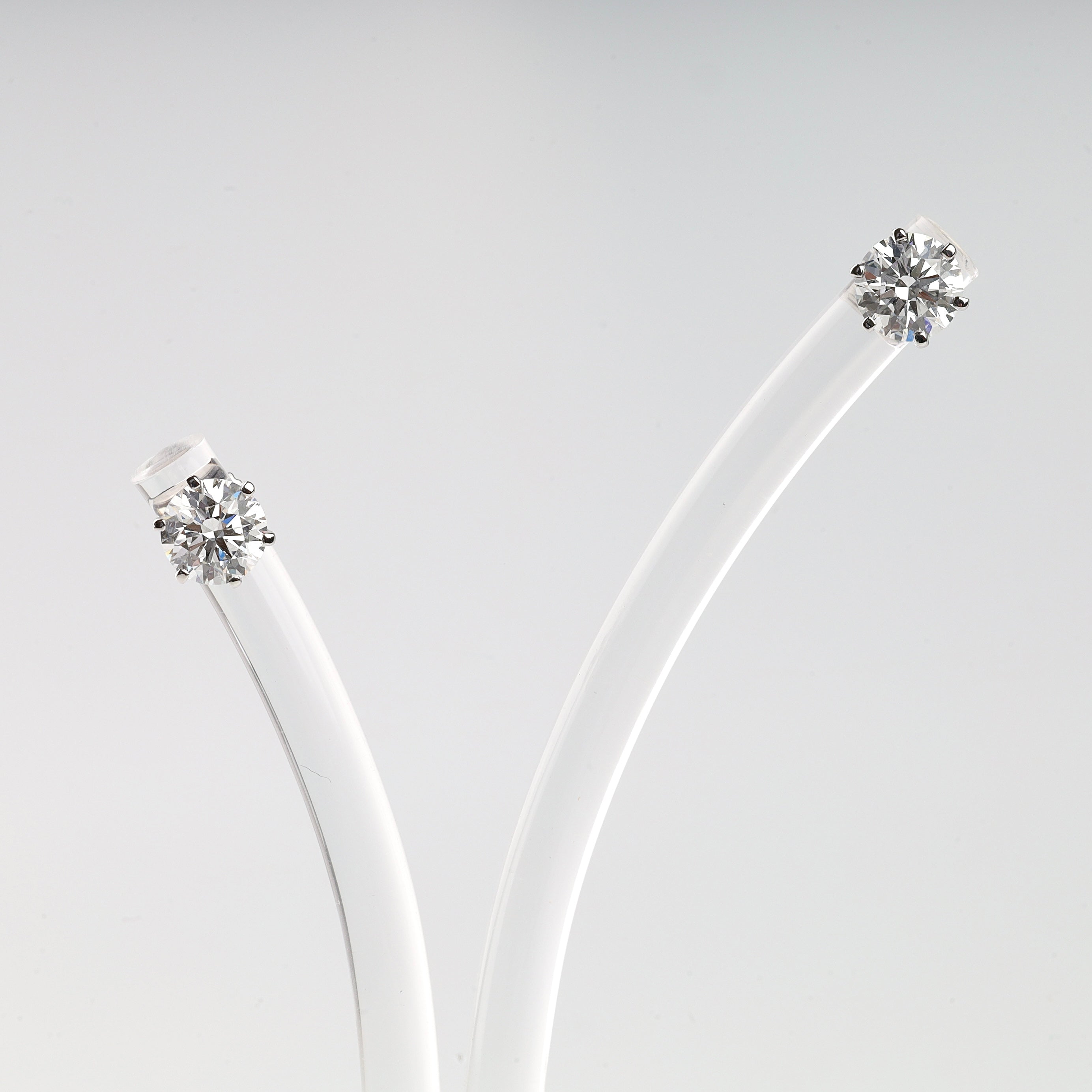 Lab-grown diamond earrings with screw-back closure and IGI documentation