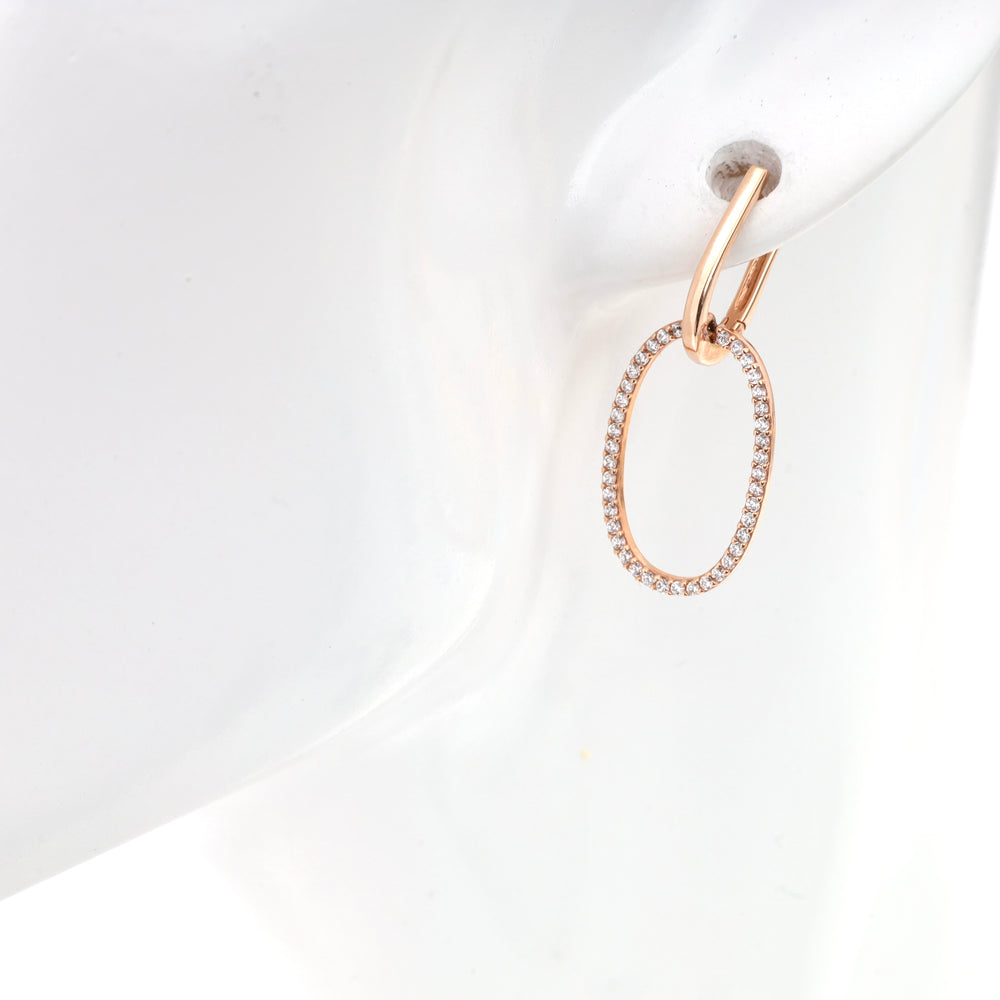 Rose gold hoop earring with crystal oval pendant on mannequin.