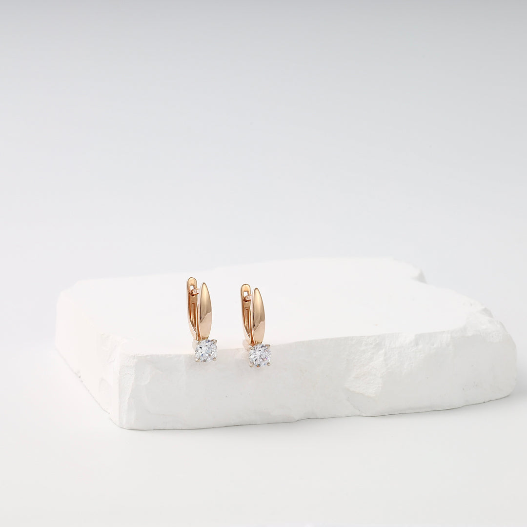 14k gold drop earrings with round clear stones on white stone display, elegant Ukrainian Jewelry, diamond earrings gift.