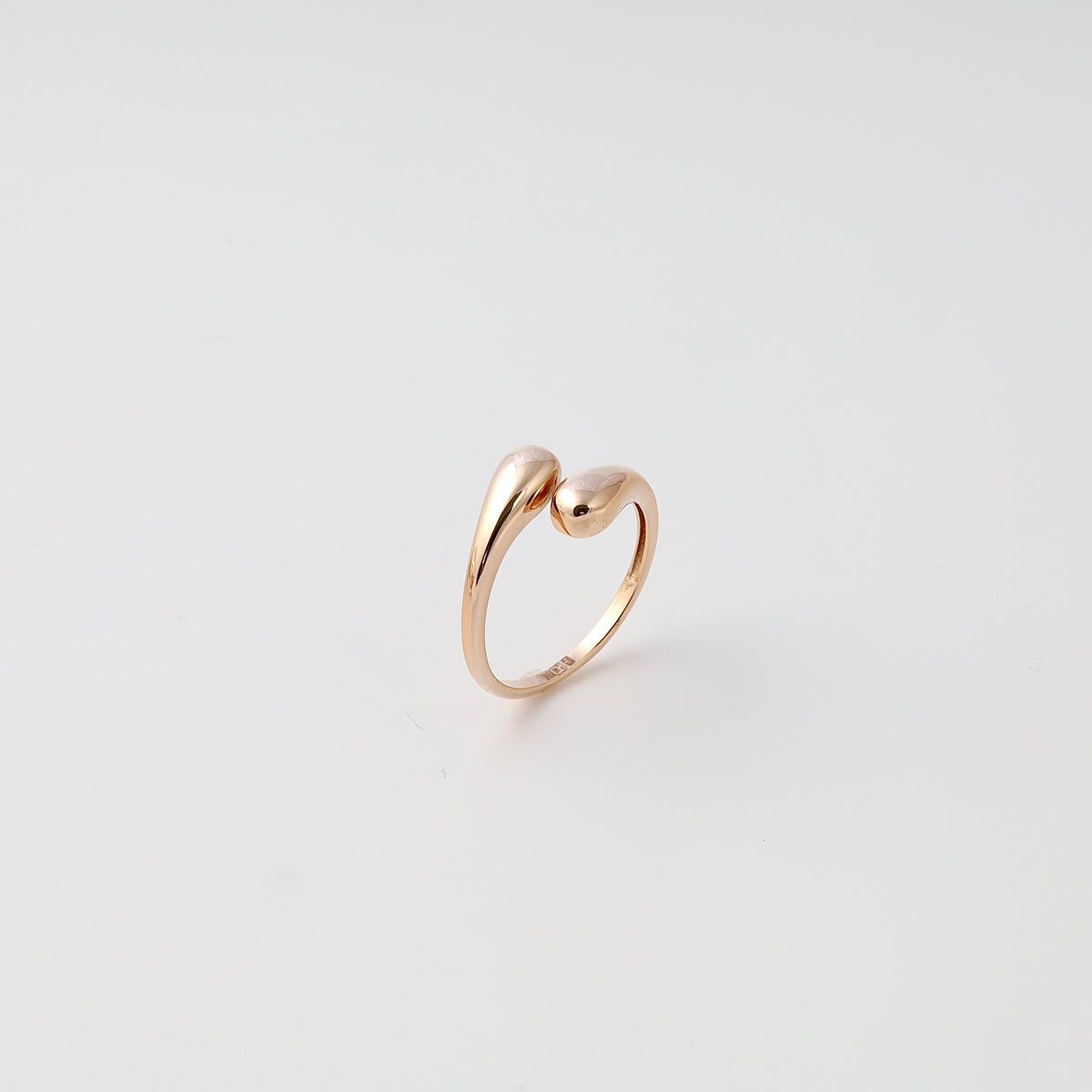 Minimalist 14k gold open ring with two teardrop ends on white background, Ukrainian Jewelry, dainty gold ring, stacking ring.