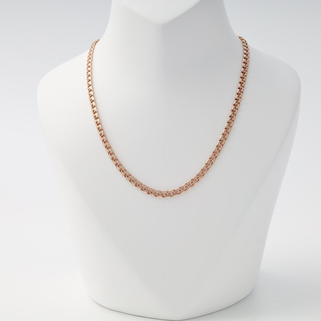 Rose gold chain necklace with a rounded box link pattern displayed on a white jewelry bust.