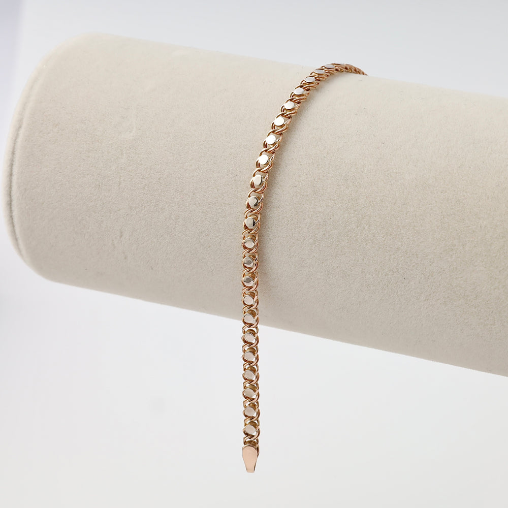 Rose gold chain link 14k gold bracelet displayed on a neutral stand, fine chain jewelry by Ukrainian Jewelry for everyday wear.