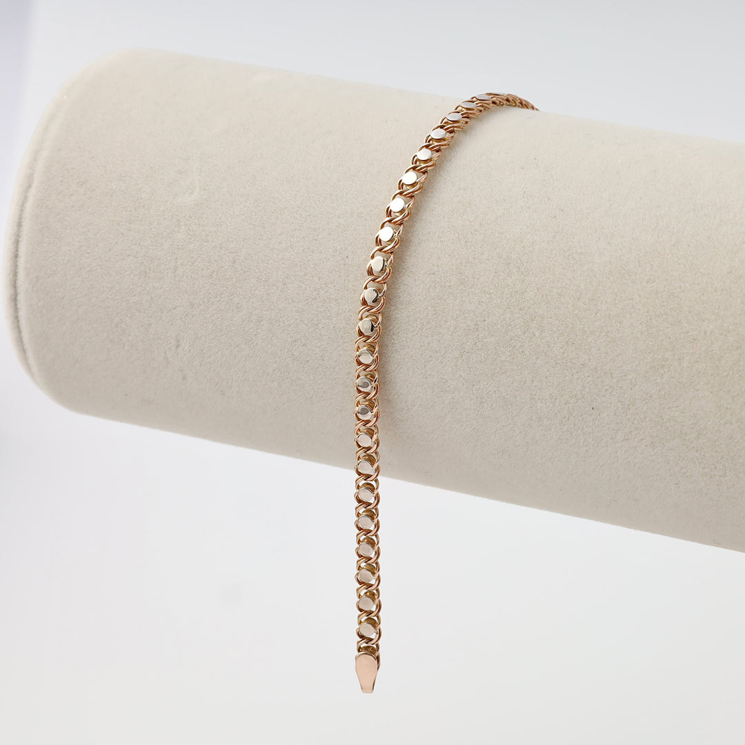 Rose gold chain link 14k gold bracelet displayed on a neutral stand, fine chain jewelry by Ukrainian Jewelry for everyday wear.