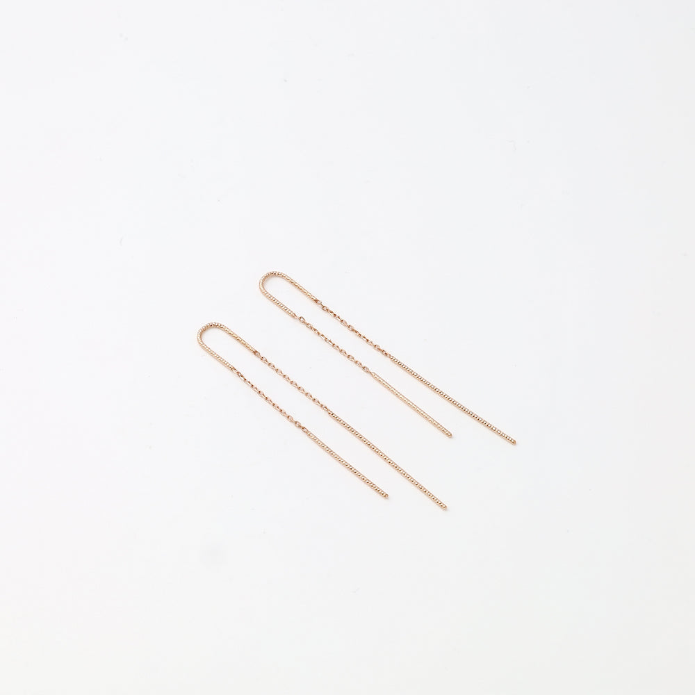 Delicate 14k gold threader chain earrings displayed on white background, minimalist drop earring Ukrainian Jewelry for women.