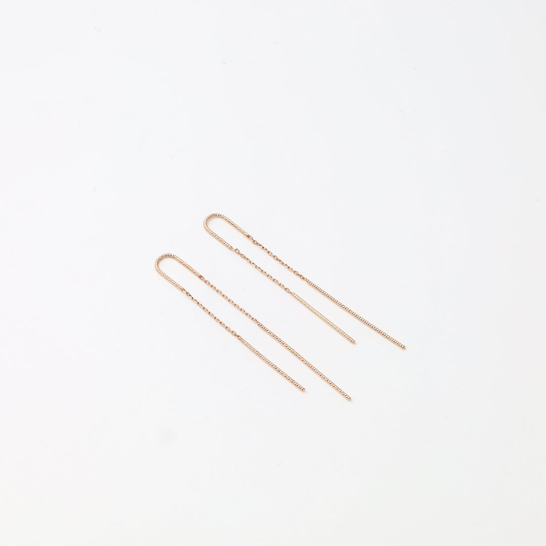 Delicate 14k gold threader chain earrings displayed on white background, minimalist drop earring Ukrainian Jewelry for women.