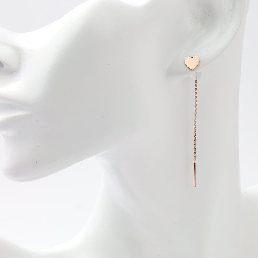 Single 14k gold heart stud with long chain drop earring displayed on ear mannequin, Ukrainian Jewelry, minimalist gold dangle earrings.