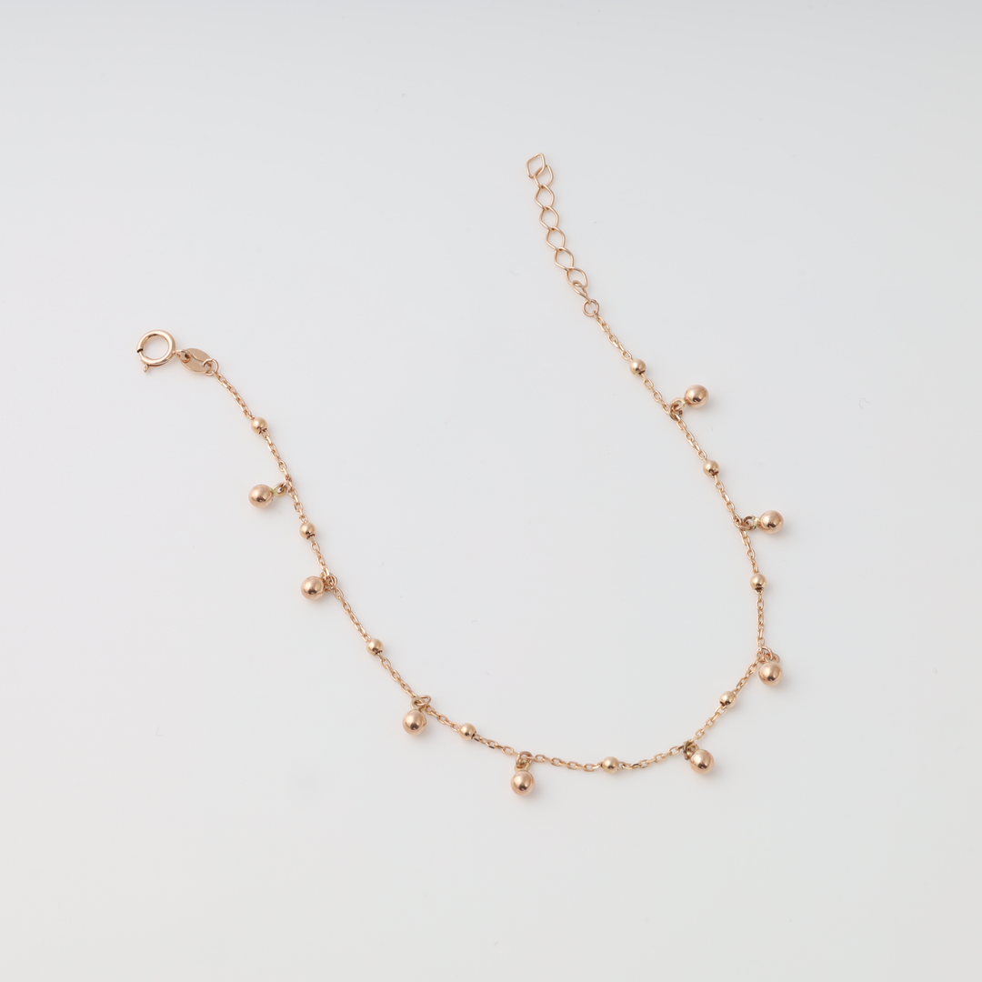 Delicate 14k gold chain bracelet with small bead charms, adjustable clasp, minimalist Ukrainian Jewelry for women.