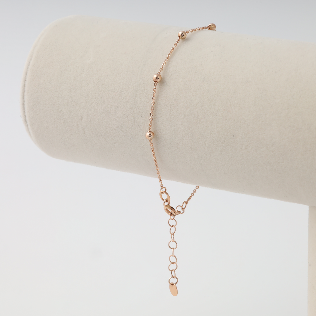 Delicate 14k gold beaded chain bracelet with extender clasp on display stand, minimalist Ukrainian Jewelry gift for women.