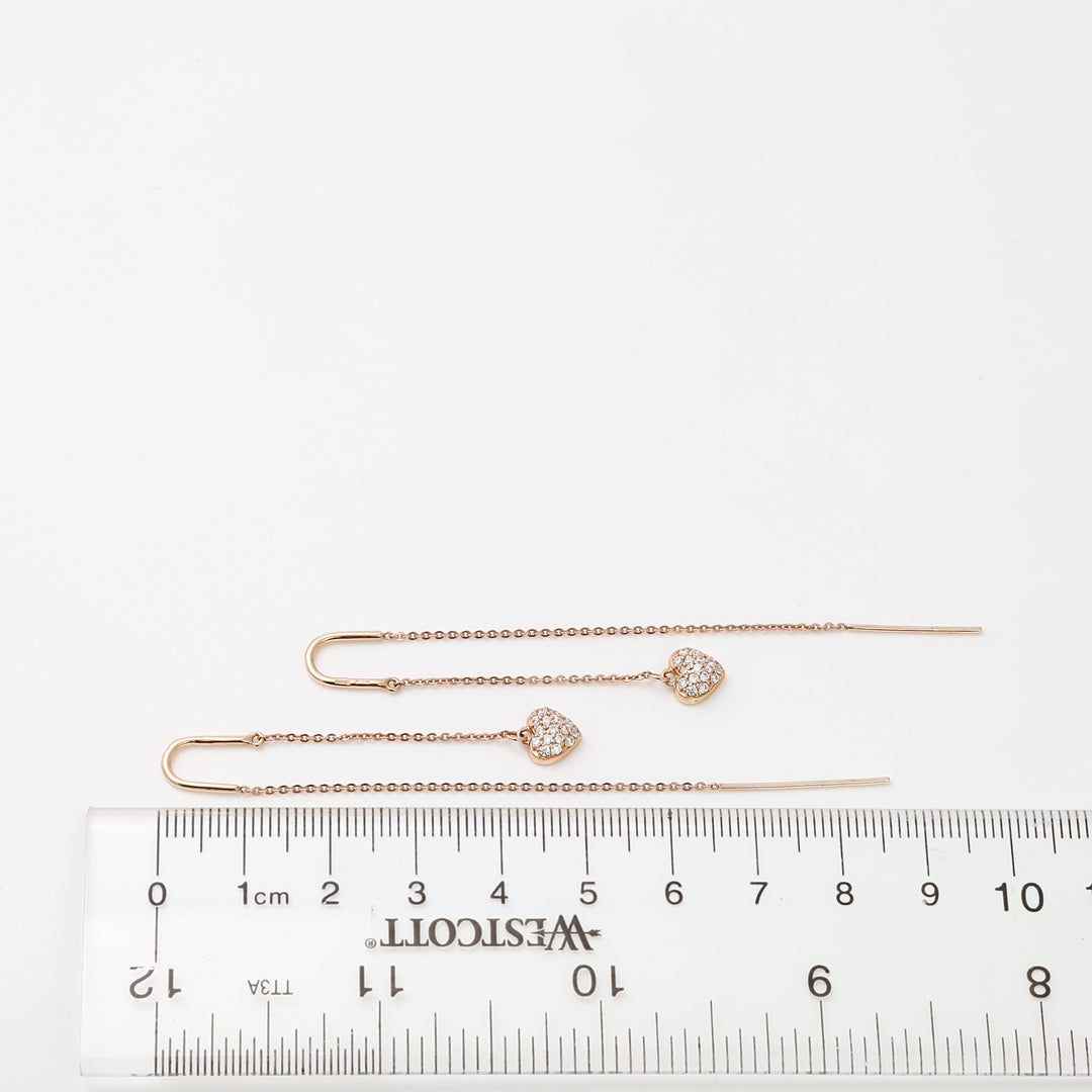 14k gold threader earrings with crystal heart charms shown by ruler, delicate dangle Ukrainian Jewelry for women.
