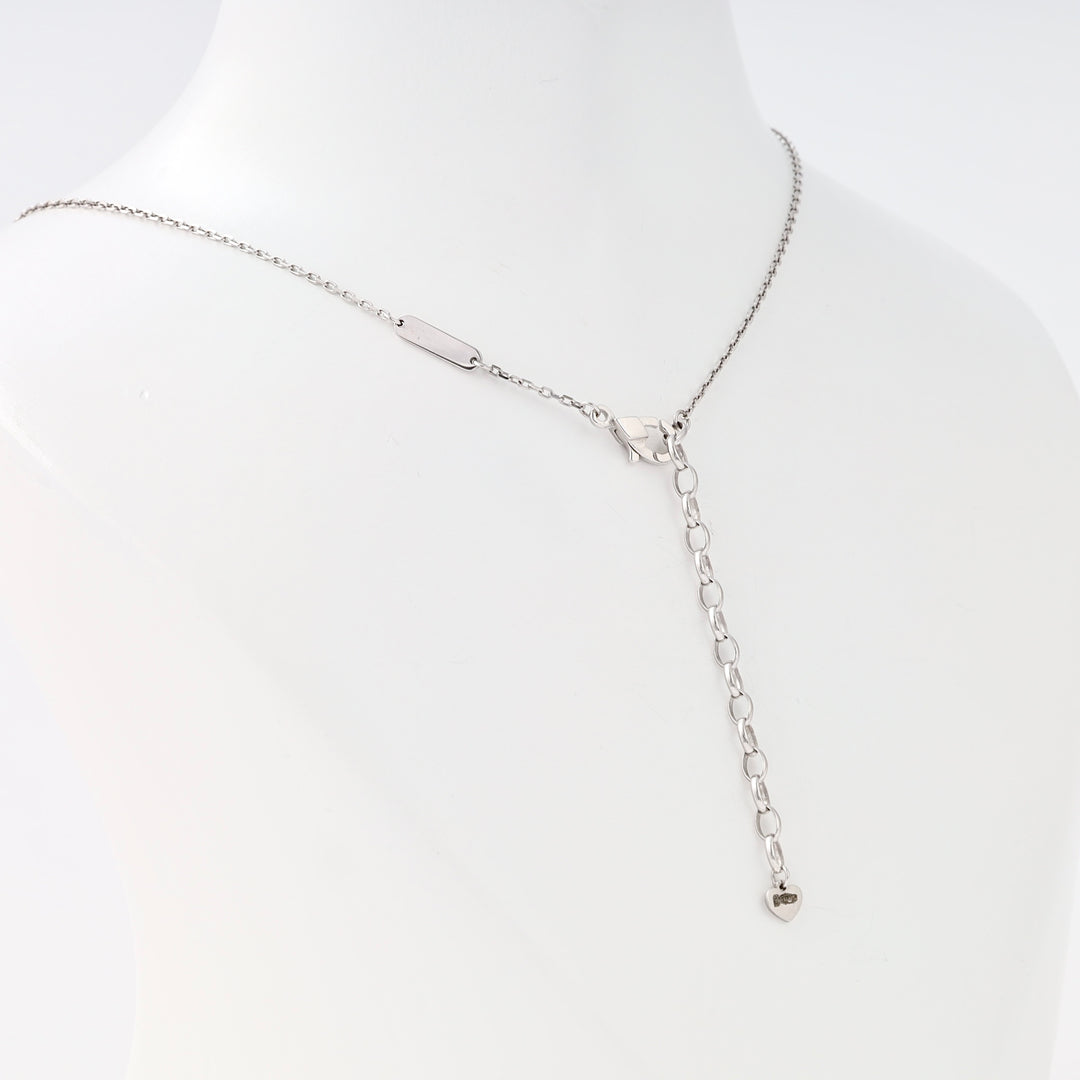Sterling silver lariat necklace with chain drop and small heart charm pendant on bust display, modern Ukrainian Jewelry for women.