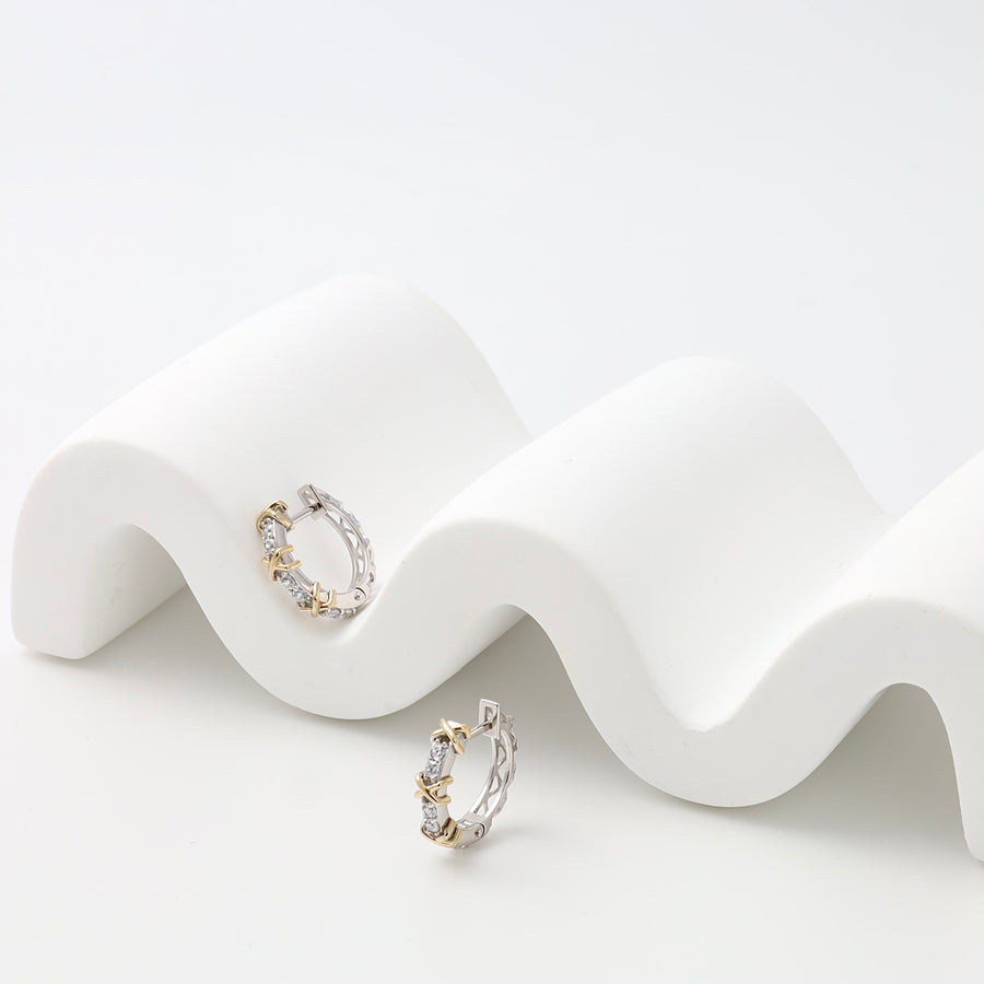 Sterling silver and gold hoop earrings with crystal stones on a white display, Ukrainian Jewelry, delicate everyday hoop earrings.