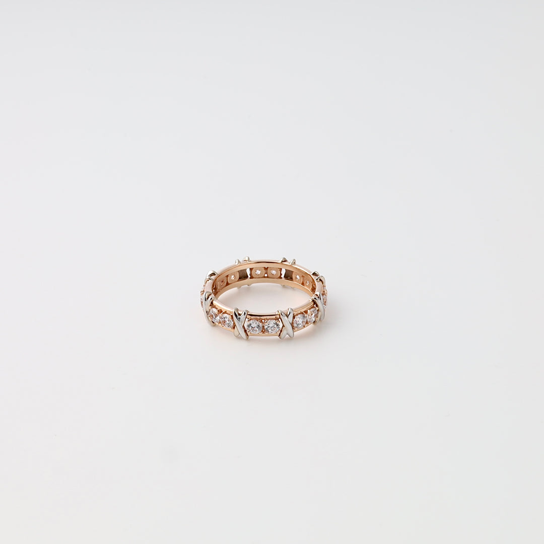 Rose gold and silver diamond eternity band ring on white background, Ukrainian Jewelry wedding ring, gold engagement ring.