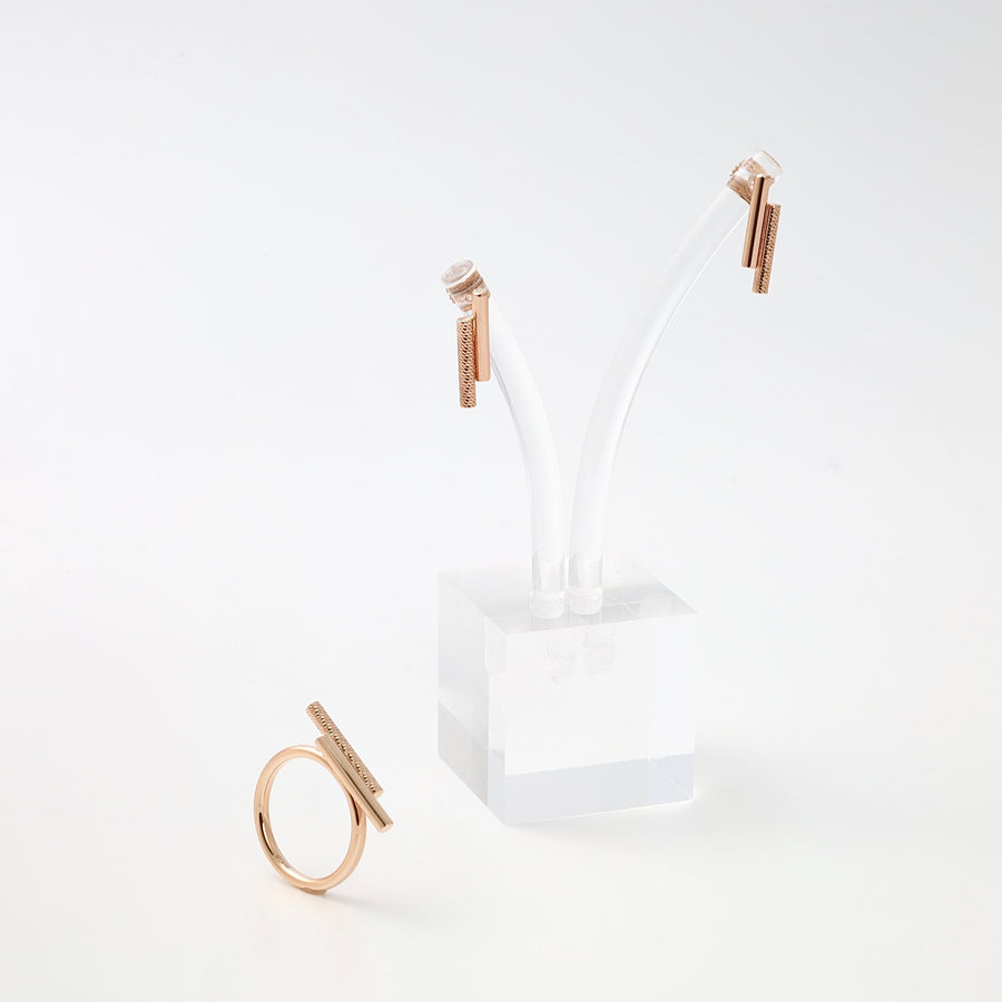 Minimalist 14k gold bar ring and matching bar stud earrings on white stand, modern Ukrainian Jewelry set for everyday wear.