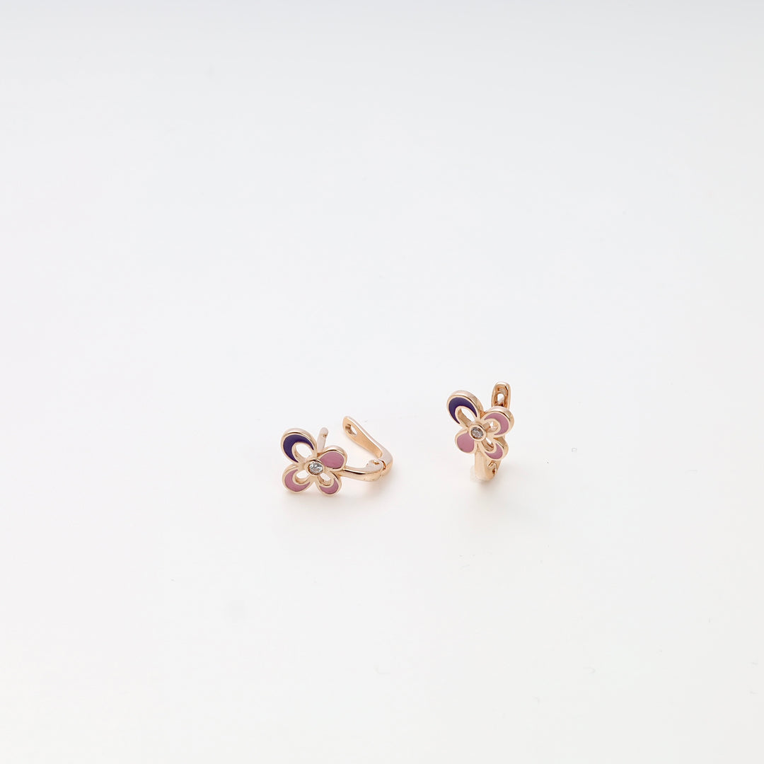 14k gold kids hoop earrings with pink enamel flower and small crystal, displayed on white background, Ukrainian Jewelry gift for girls.