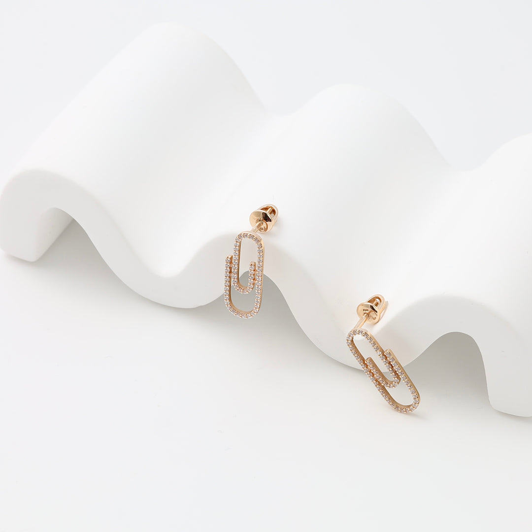 Rose gold earrings with double paperclip links and tiny crystals, modern drop gold earrings, Ukrainian Jewelry on white display.