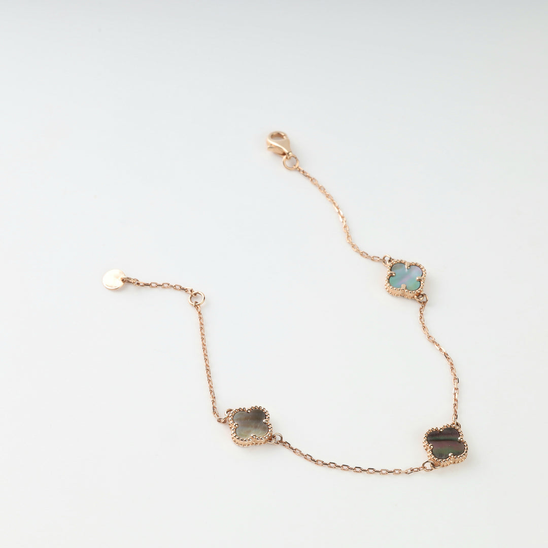 14K (585) rose gold bracelet with three four-leaf clovers in grey mother-of-pearl, lobster clasp and extender chain