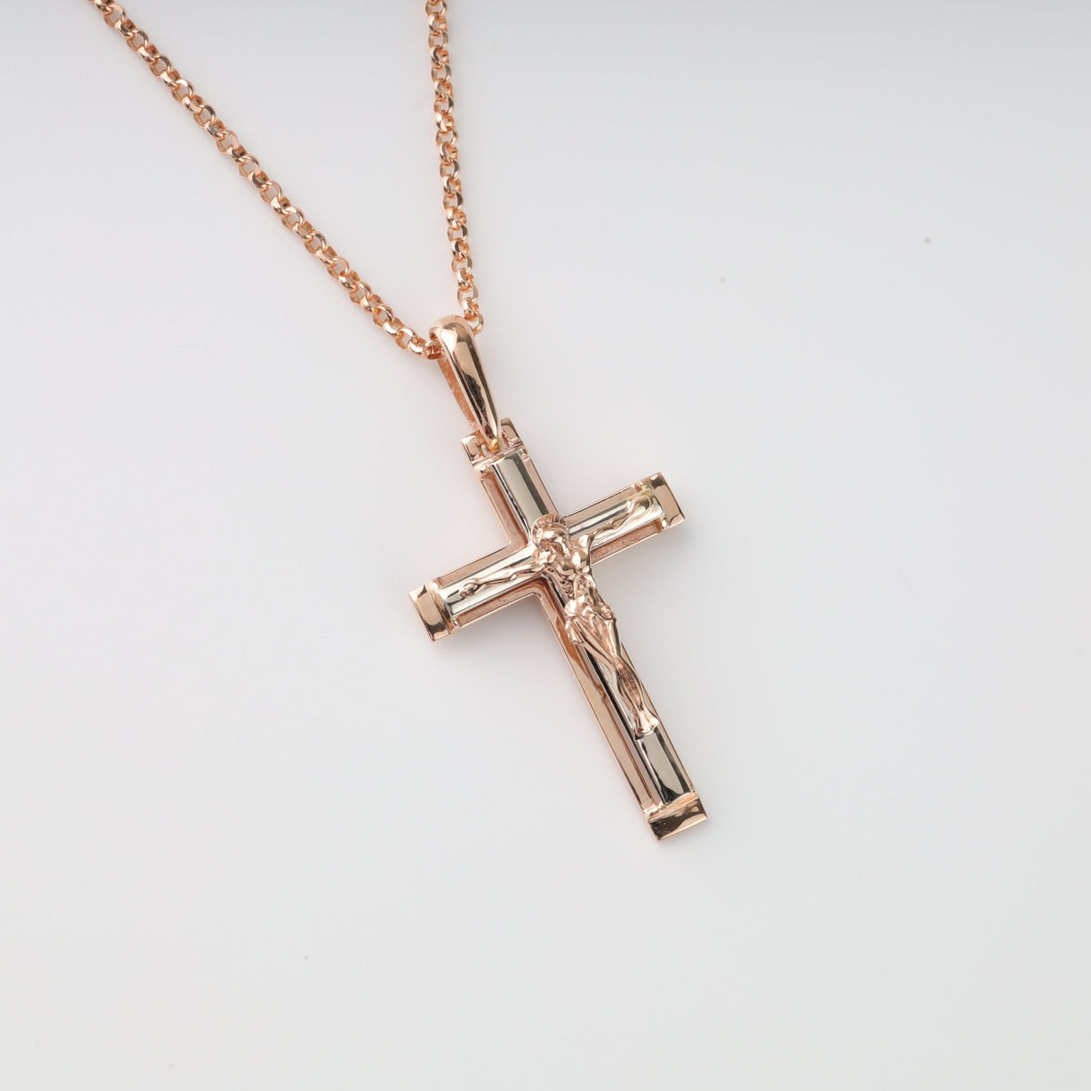 Two-tone crucifix cross pendant in 14K (585) rose gold on a chain